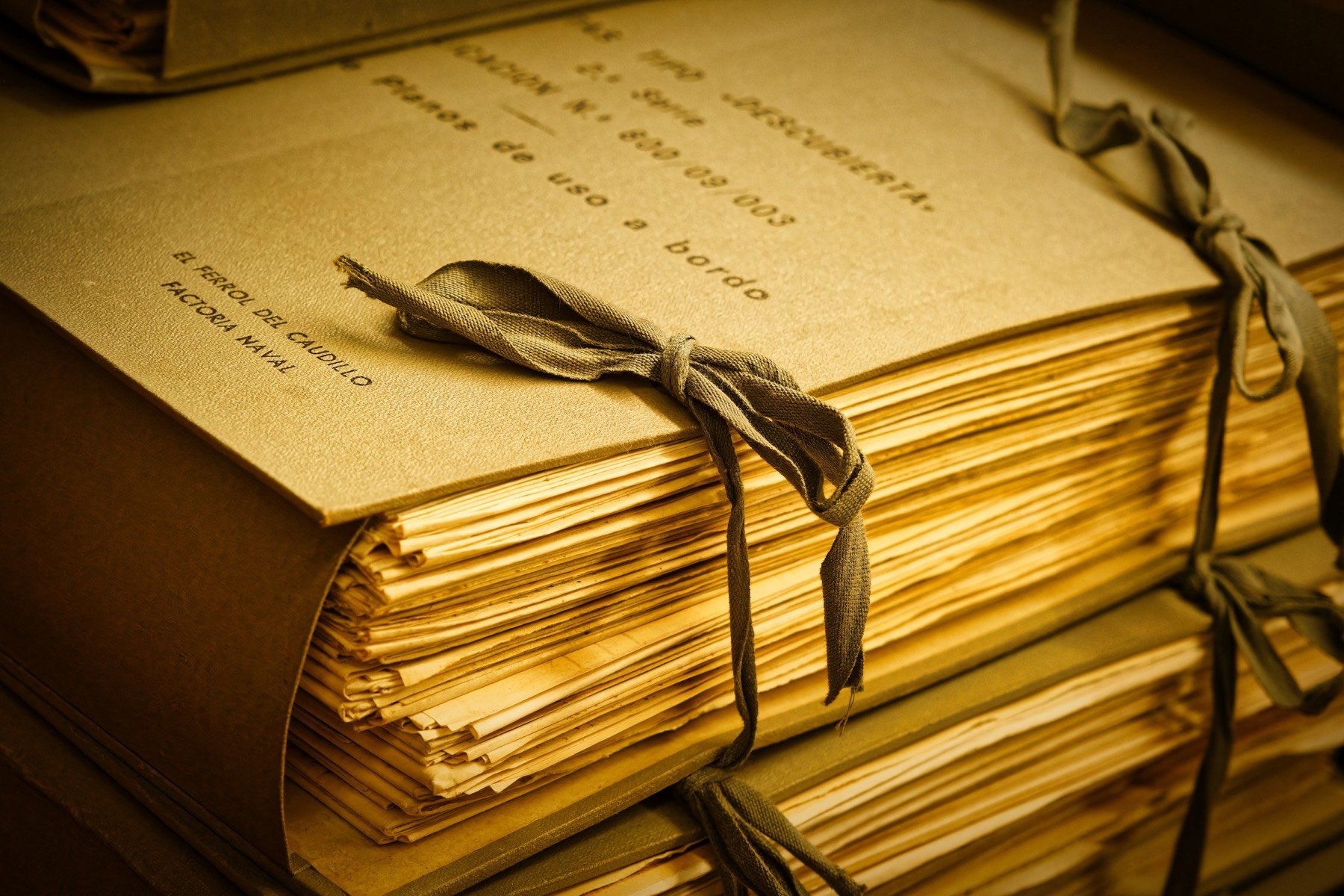 Archived paper files tied in bundles